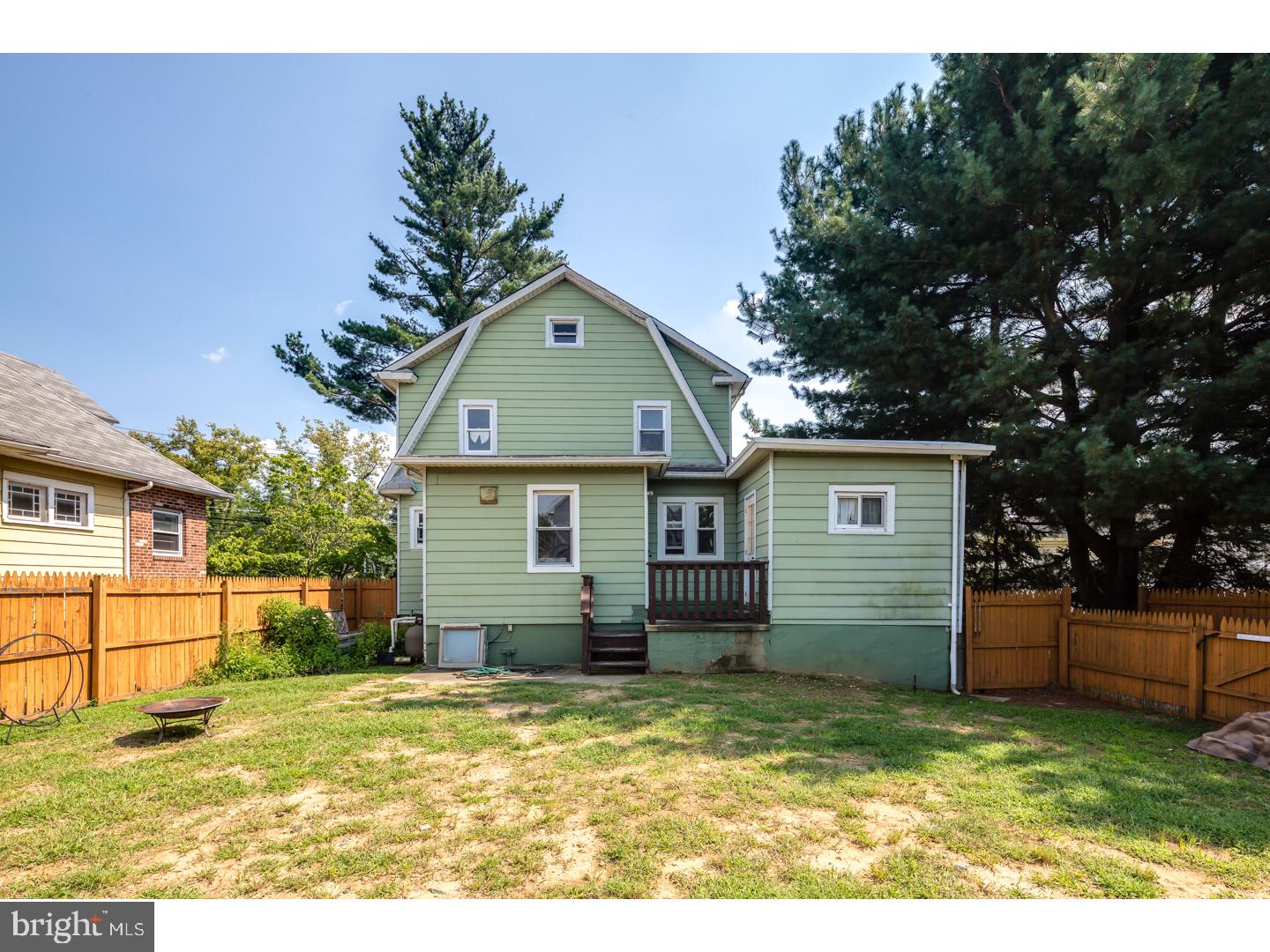 213 Clements Bridge Road Barrington, NJ 08007 - Photo 25 of 25 a view of a yard in front of a house with a large tree