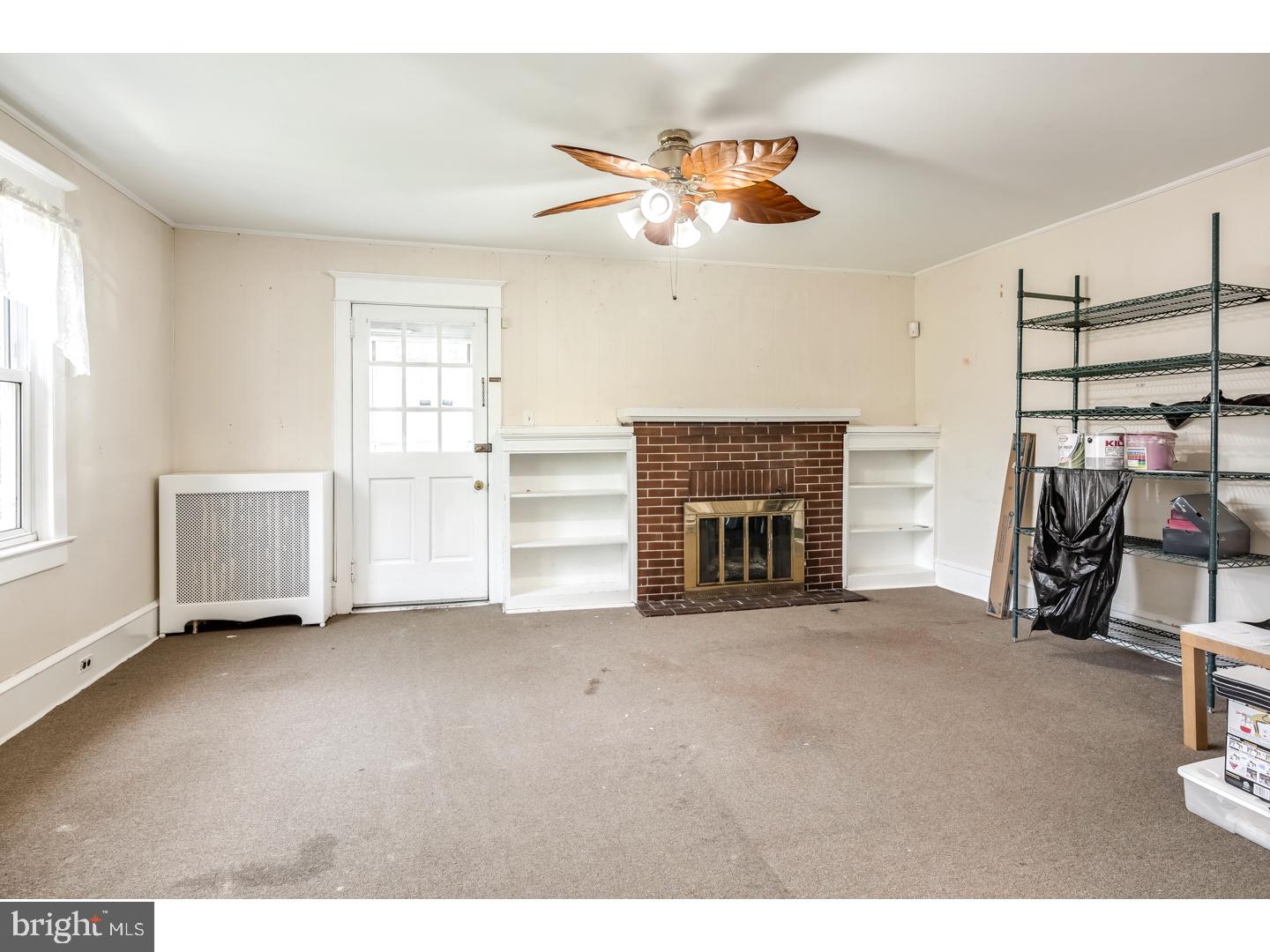213 Clements Bridge Road Barrington, NJ 08007 - Photo 3 of 25 a view of a livingroom with a fireplace and workspace