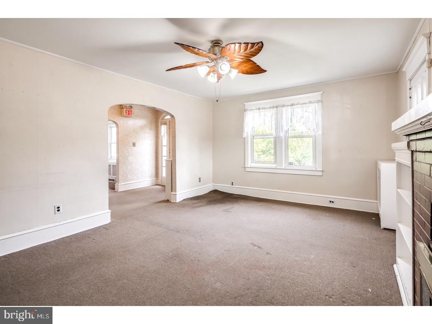 213 Clements Bridge Road Barrington, NJ 08007 - Photo 4 of 25 a view of an empty room with a window