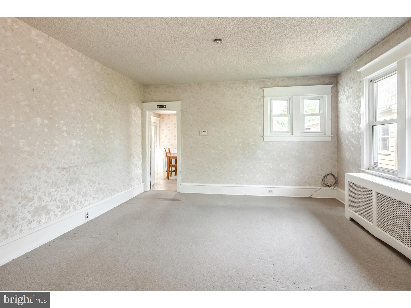 213 Clements Bridge Road Barrington, NJ 08007 - Photo 6 of 25 a view of an empty room with a window