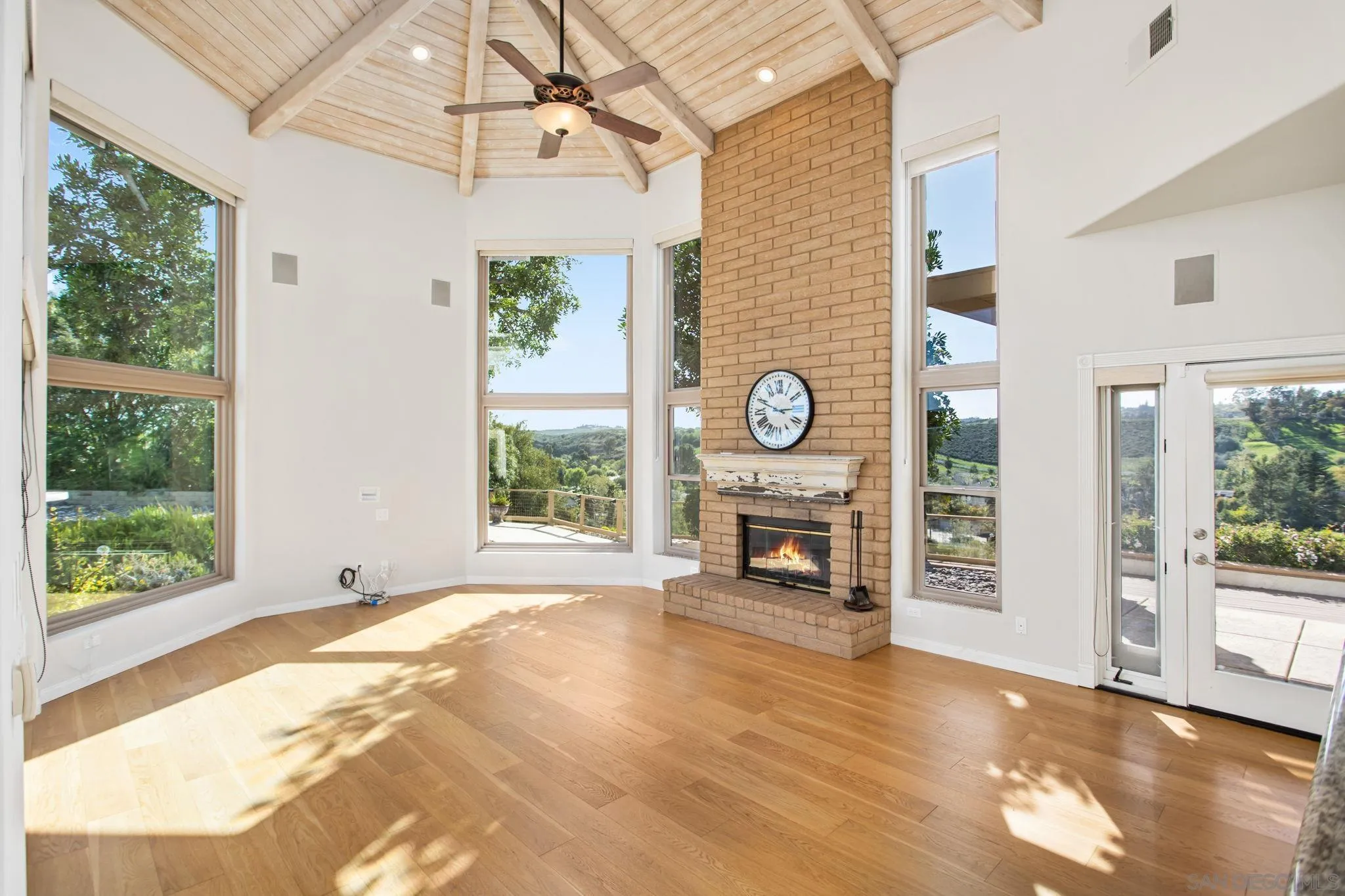 4489 Fallsbrae Road Fallbrook, CA 92028 - Photo 12 of 46 a view of a livingroom with a fireplace and a window