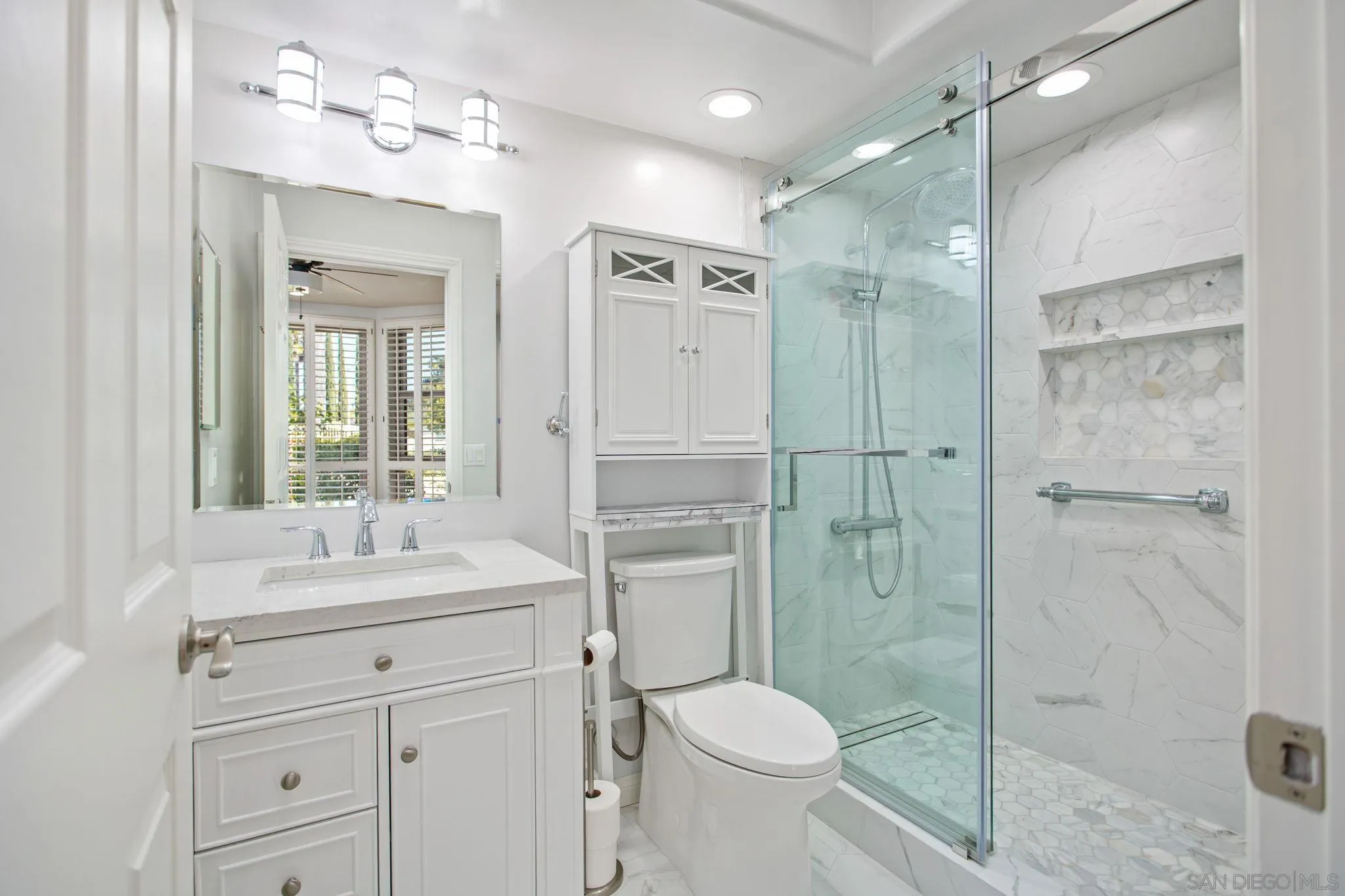 4489 Fallsbrae Road Fallbrook, CA 92028 - Photo 17 of 46 a bathroom with a shower sink vanity mirror and toilet