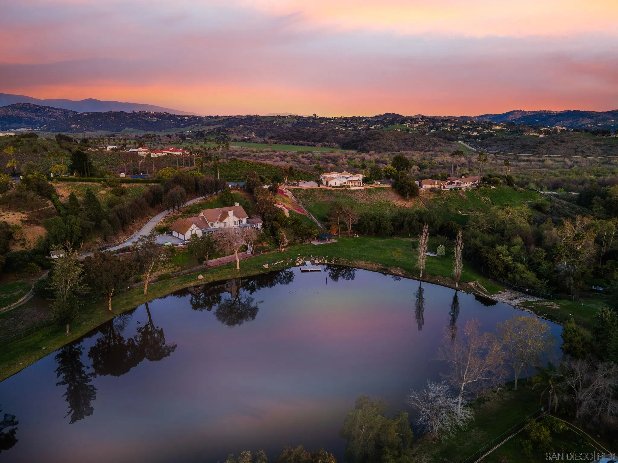 4489 Fallsbrae Road Fallbrook, CA 92028 - Photo 2 of 46 a view of a lake with a mountain