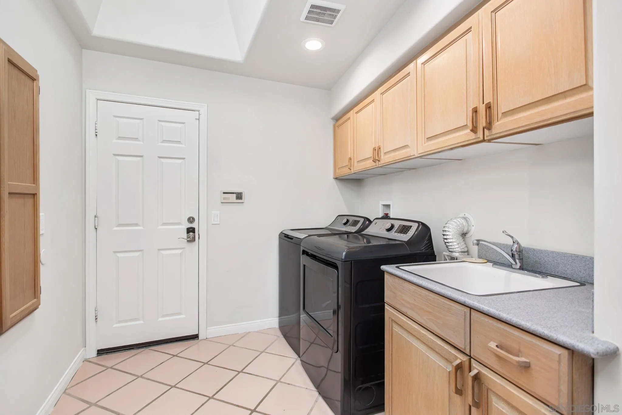 4489 Fallsbrae Road Fallbrook, CA 92028 - Photo 27 of 46 a utility room with sink dryer and washer