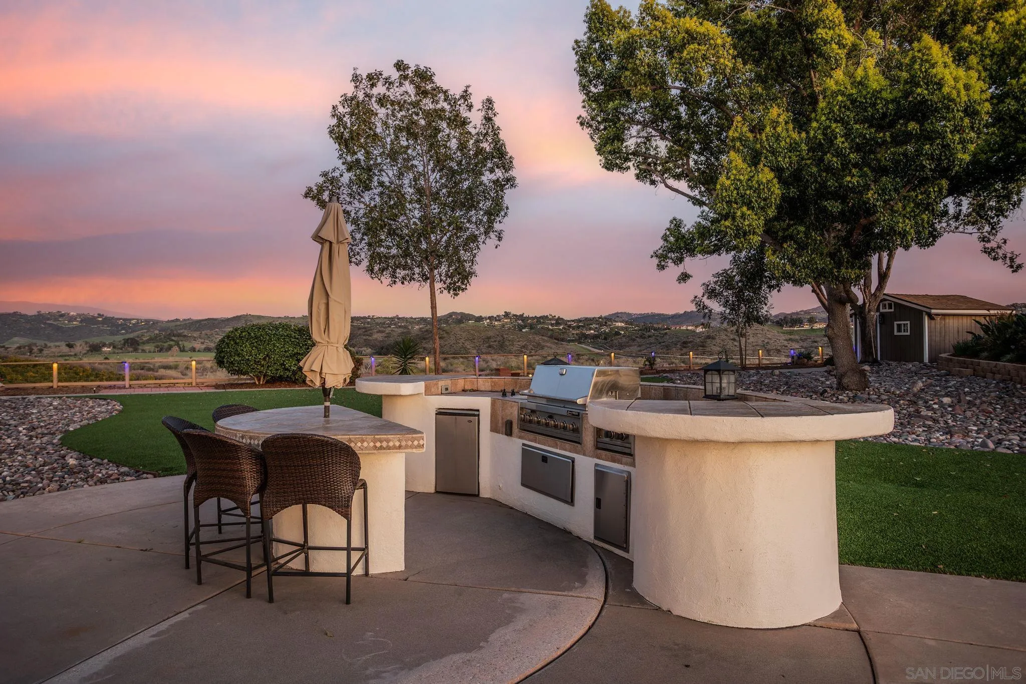 4489 Fallsbrae Road Fallbrook, CA 92028 - Photo 30 of 46 a patio with lake view and a garden