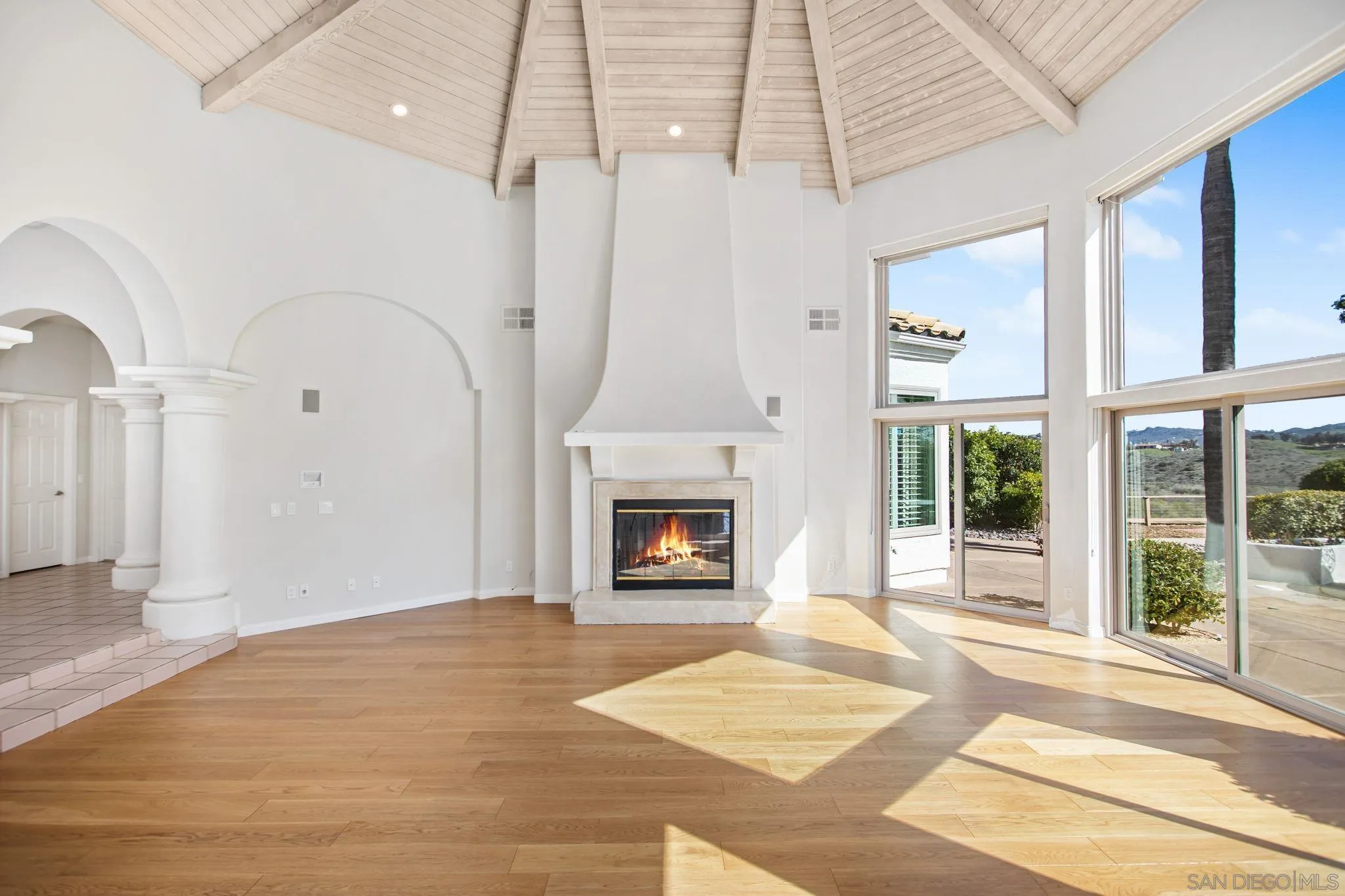4489 Fallsbrae Road Fallbrook, CA 92028 - Photo 3 of 46 a view of a livingroom with a fireplace and windows