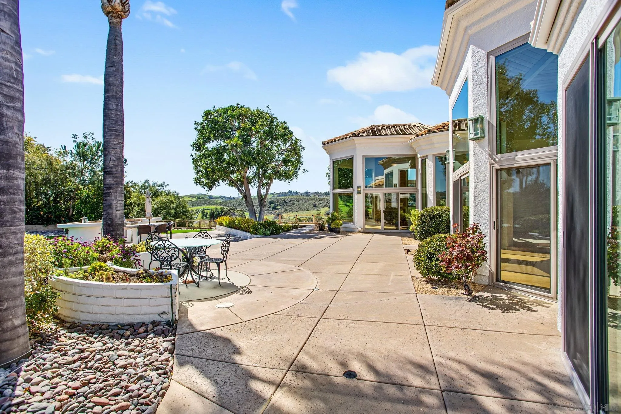 4489 Fallsbrae Road Fallbrook, CA 92028 - Photo 34 of 46 a view of a patio with dining table and chairs