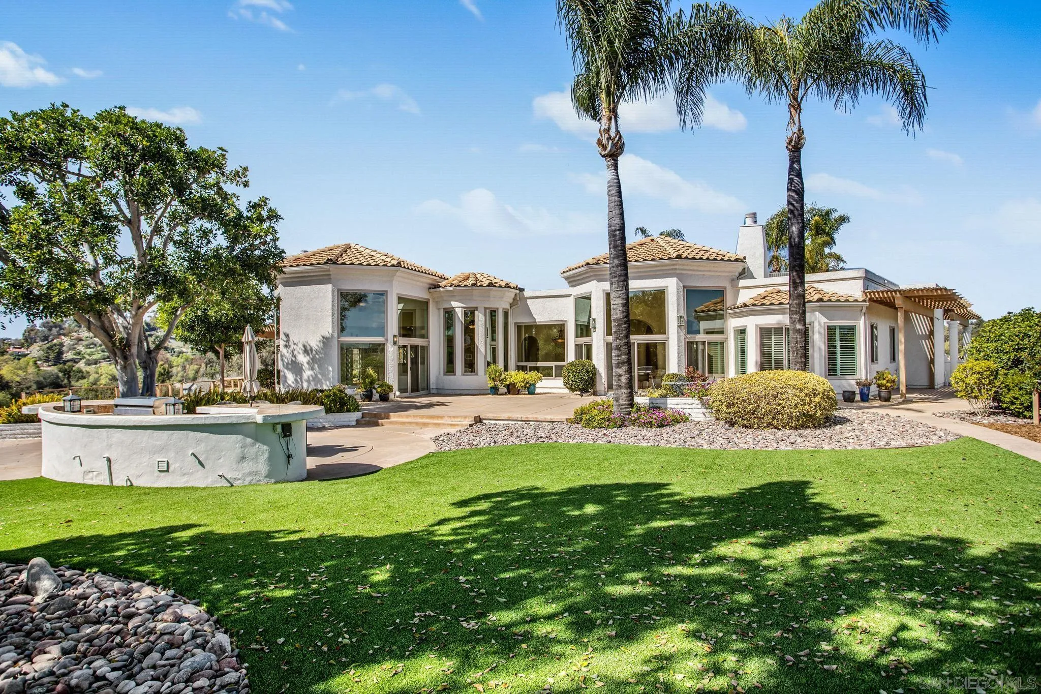 4489 Fallsbrae Road Fallbrook, CA 92028 - Photo 37 of 46 a front view of a house with swimming pool having outdoor seating