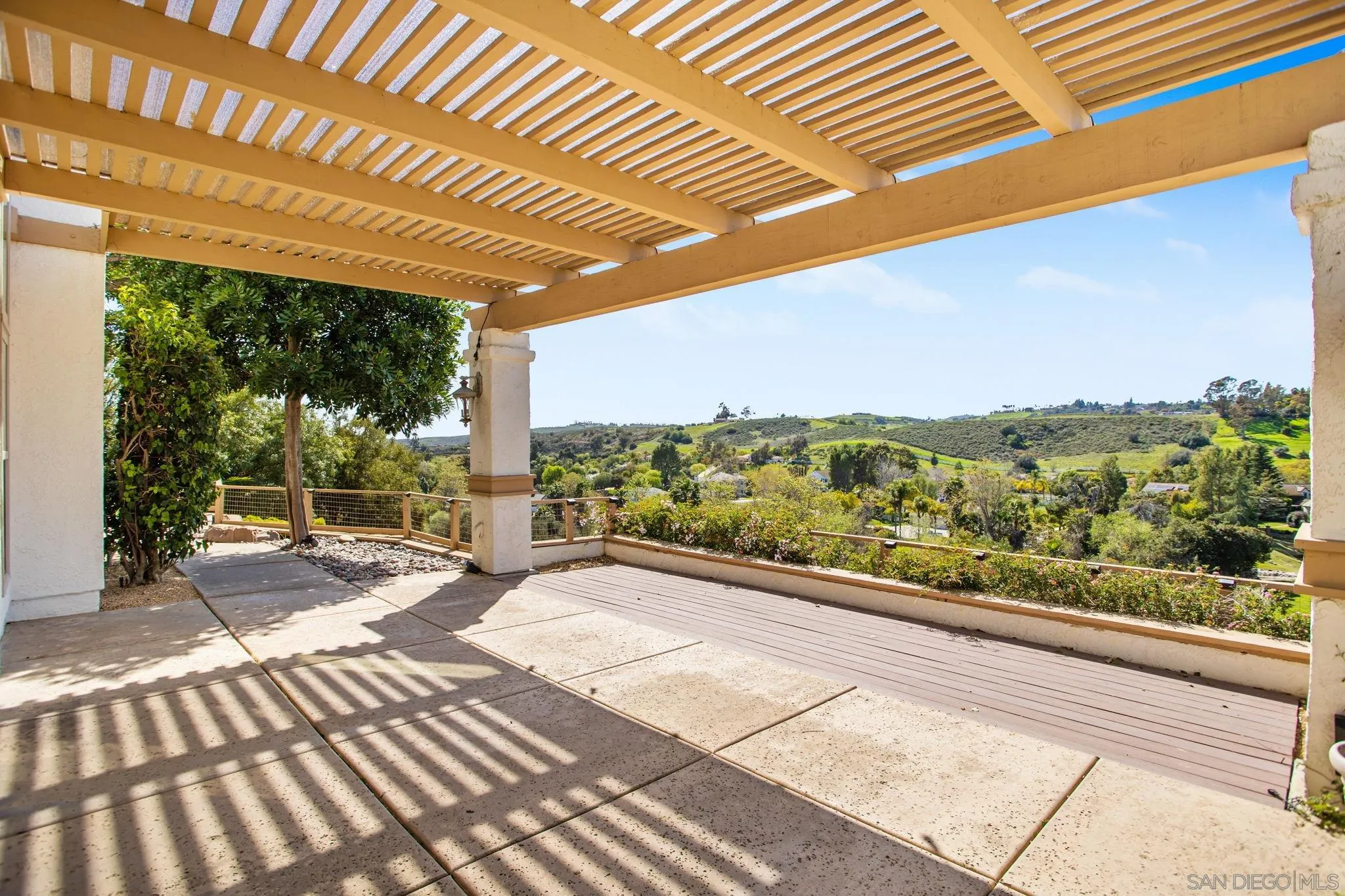 4489 Fallsbrae Road Fallbrook, CA 92028 - Photo 40 of 46 a view of a patio with a table chairs and a patio