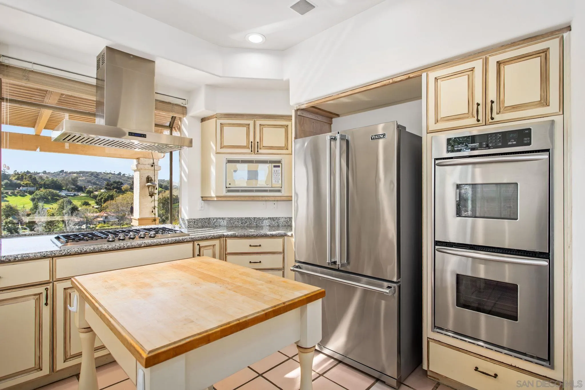 4489 Fallsbrae Road Fallbrook, CA 92028 - Photo 10 of 46 a kitchen with stainless steel appliances granite countertop a refrigerator and a stove top oven