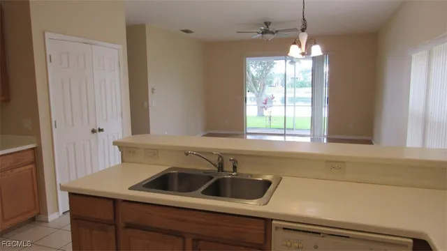 a kitchen with a sink and a window