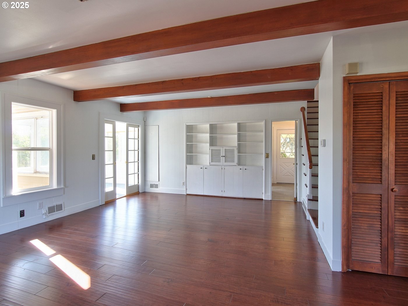 19945 Northeast Ribbon Ridge Road Newberg, OR 97132 - Photo 5 of 47 a view of an empty room with wooden floor and a window
