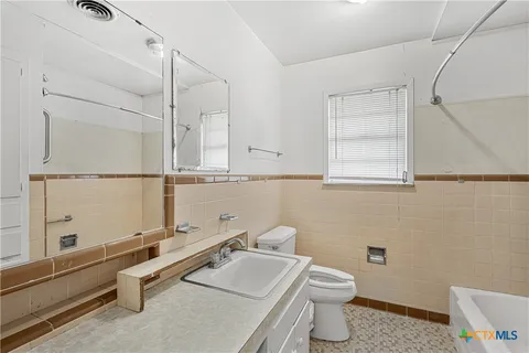 a bathroom with a sink and a toilet