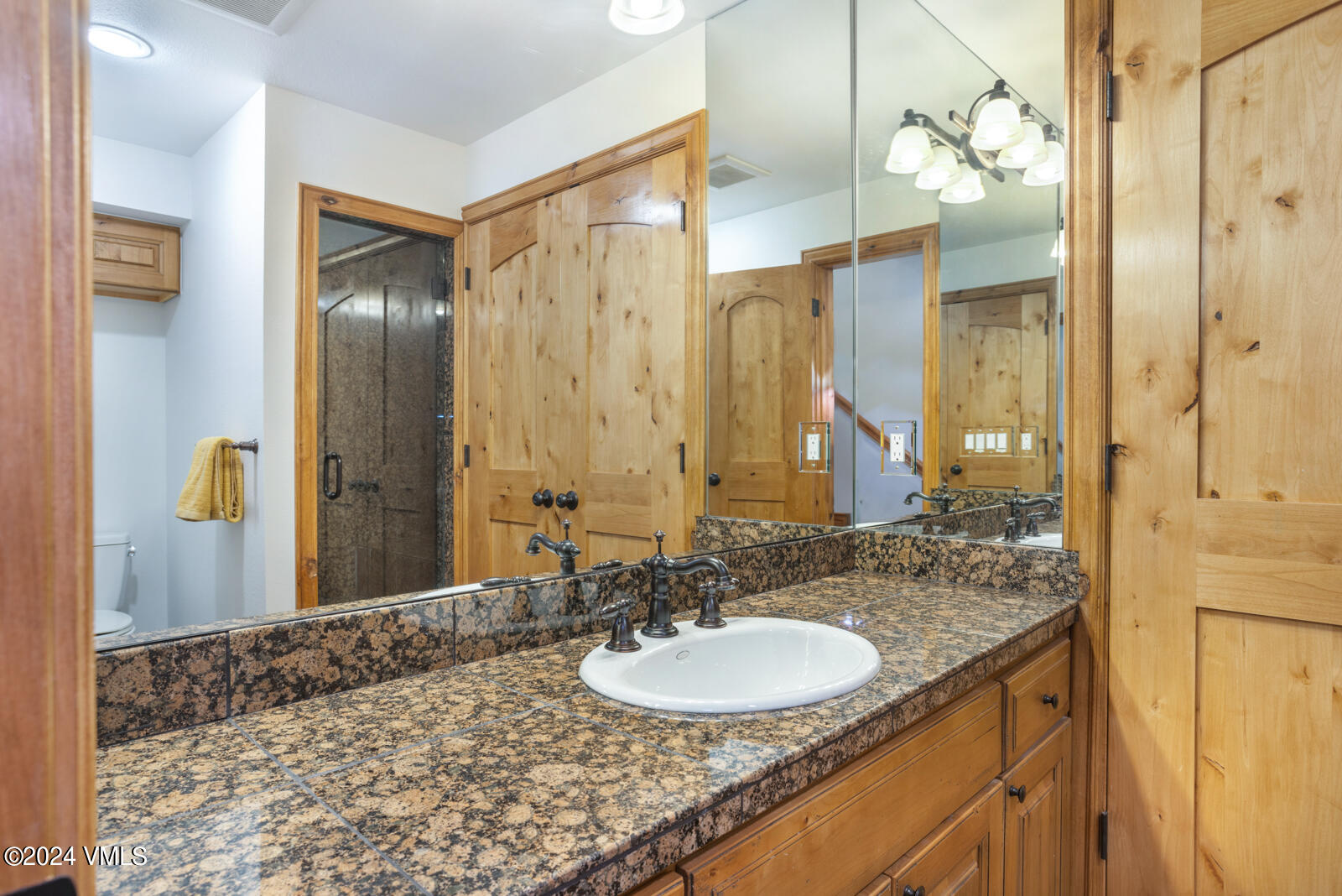 4552 Meadow Drive, Unit 24 Vail, CO 81657 - Photo 13 of 31 a bathroom with a sink and a mirror