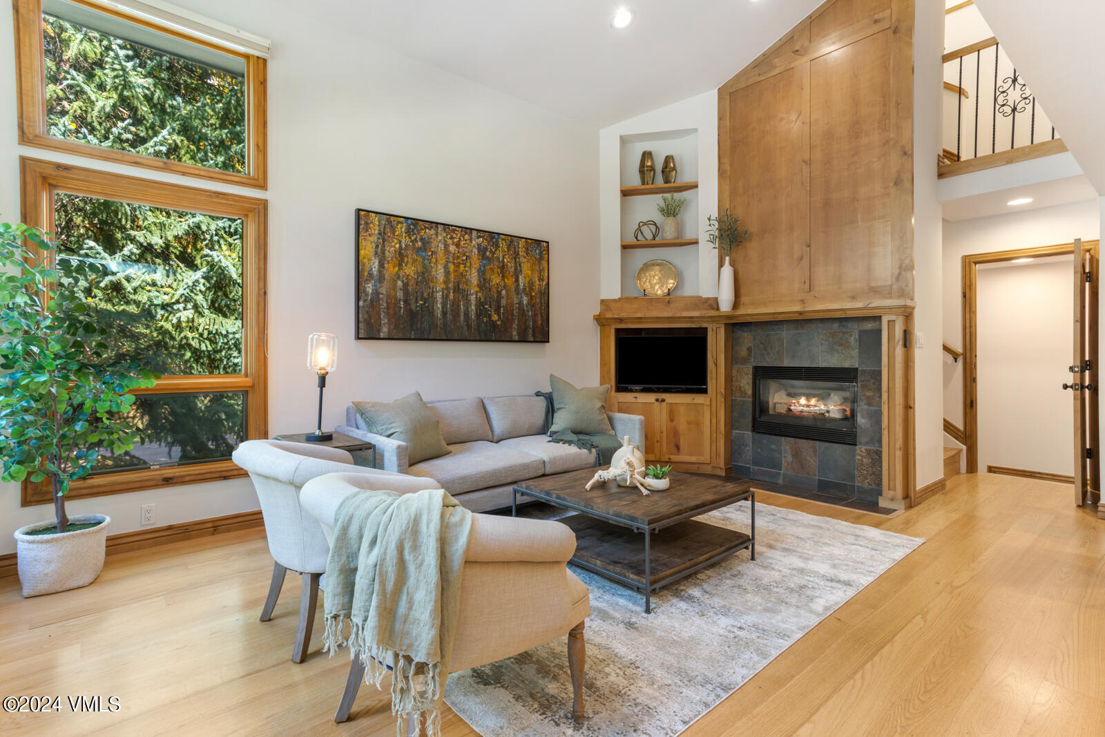 4552 Meadow Drive, Unit 24 Vail, CO 81657 - Photo 3 of 31 a living room with furniture a fireplace and a window