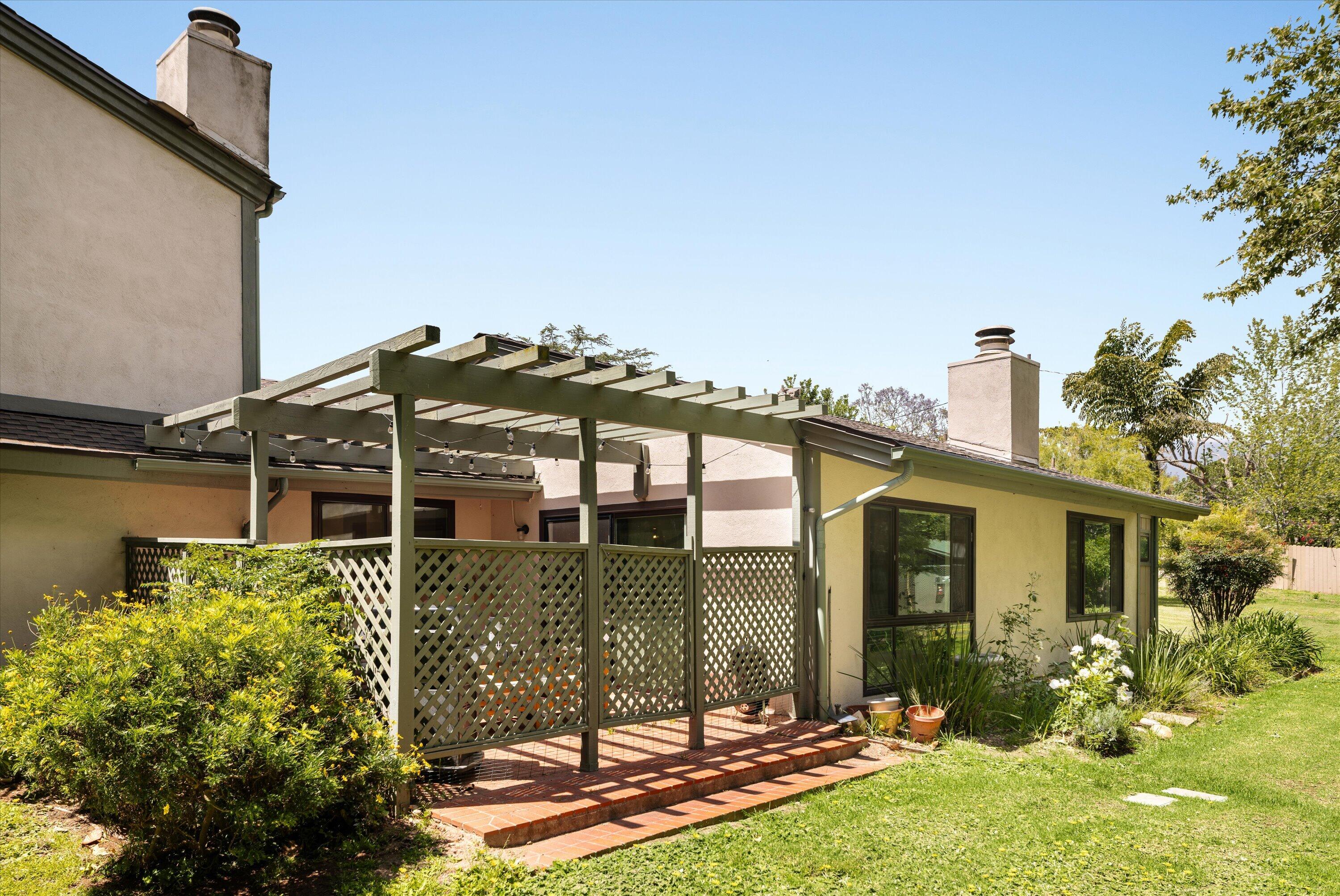 276 North La Cumbre Road Santa Barbara, CA 93110 - Photo 12 of 16 front view of a house with a yard