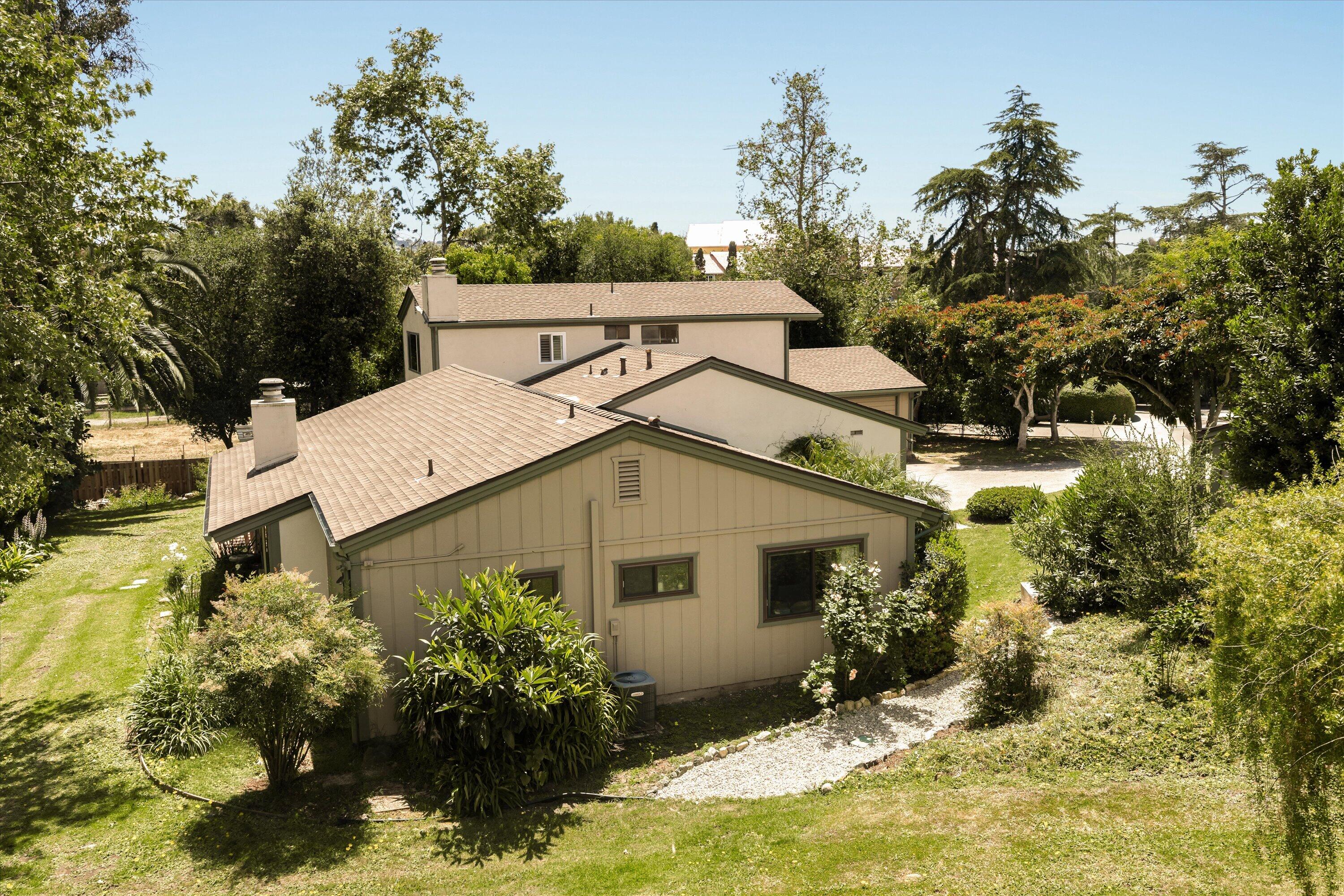 276 North La Cumbre Road Santa Barbara, CA 93110 - Photo 14 of 16 a view of a house with a yard