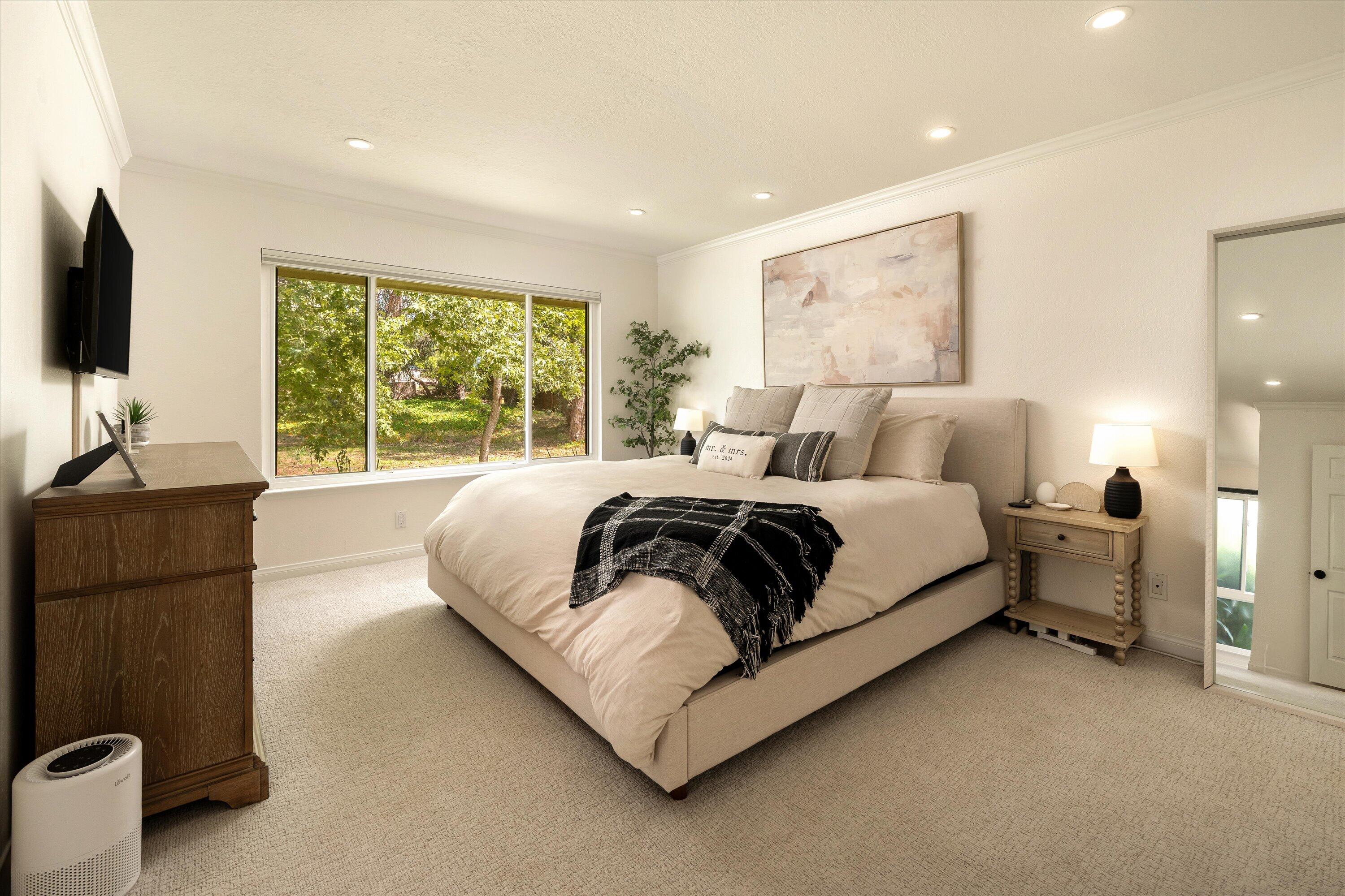 276 North La Cumbre Road Santa Barbara, CA 93110 - Photo 8 of 16 a bedroom with a bed and a flat screen tv