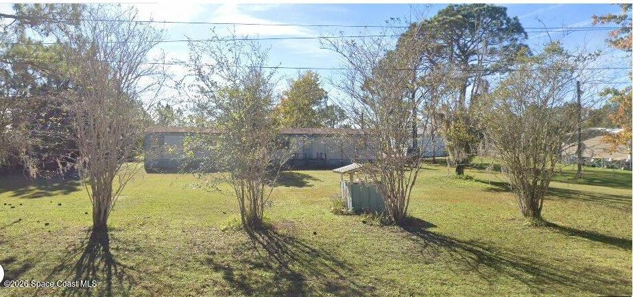 4725 Pine Needle Road Mims, FL 32754 - Photo 2 of 2 a view of a yard with an outdoor space