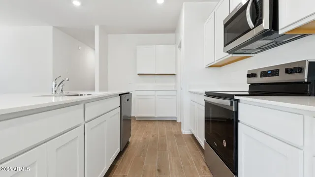 a kitchen with a sink and an oven
