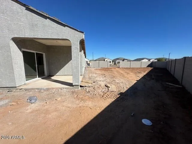 a view of a backyard of the house