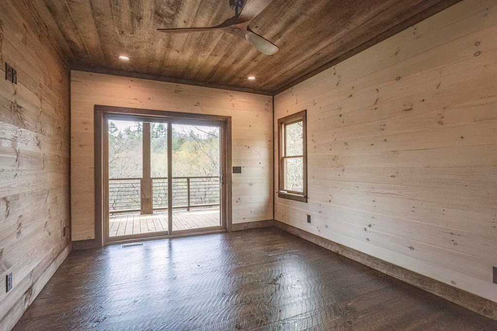 506 Pony Ghost Trail Blue Ridge, GA 30513 - Photo 16 of 62 wooden floor in an empty room with a window