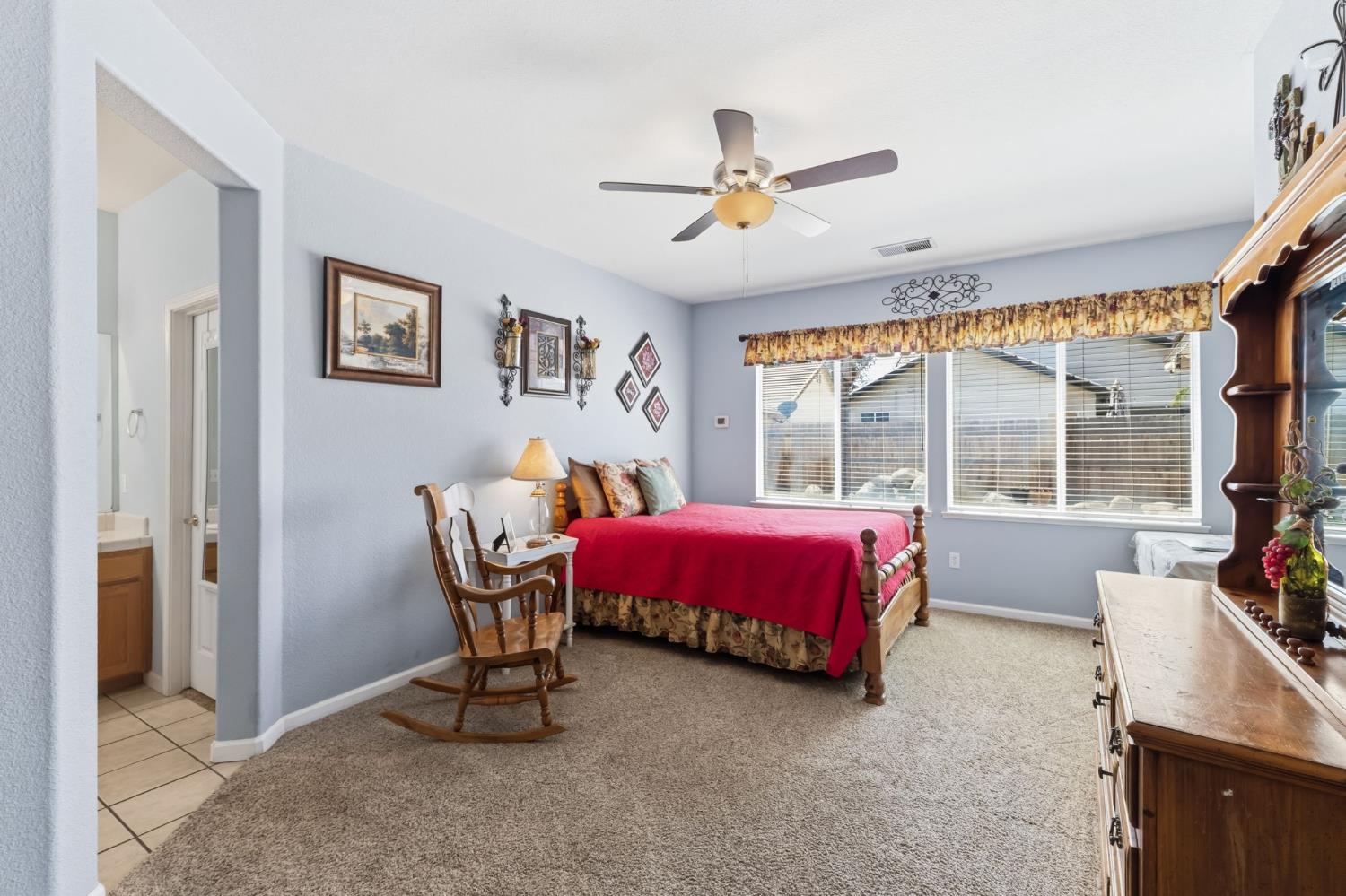 1757 Homestead Way Lemoore, CA 93245 - Photo 13 of 35 a bed room with a bed and a window