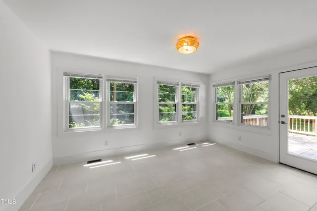 a view of an empty room with a window