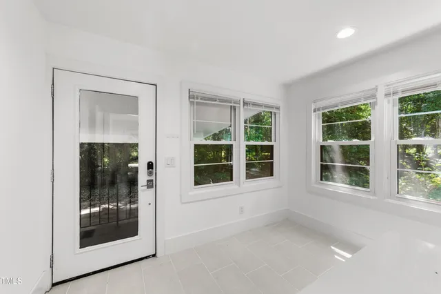 a view of an empty room with a window