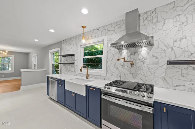 a kitchen with a stove and a sink