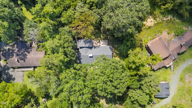 an aerial view of a house with yard and outdoor space