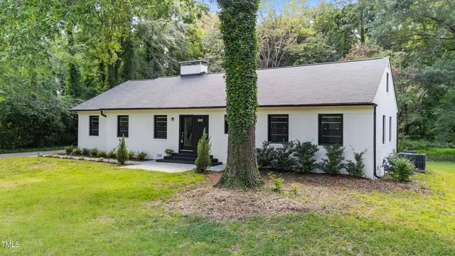 a front view of house with yard and green space