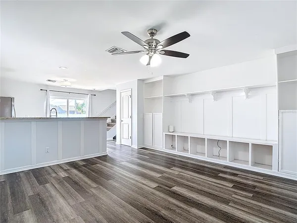 a view of a livingroom with a ceiling fan
