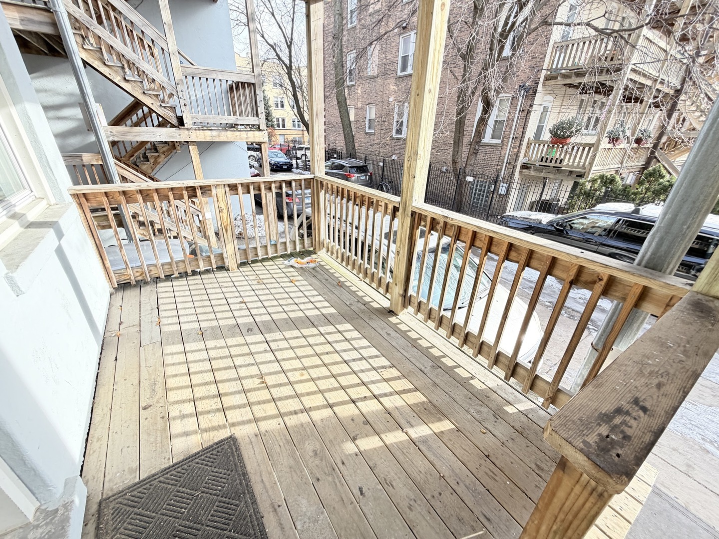 3605 West Leland Avenue, Unit 1E Chicago, IL 60625 - Photo 14 of 14 a view of a balcony with wooden floor