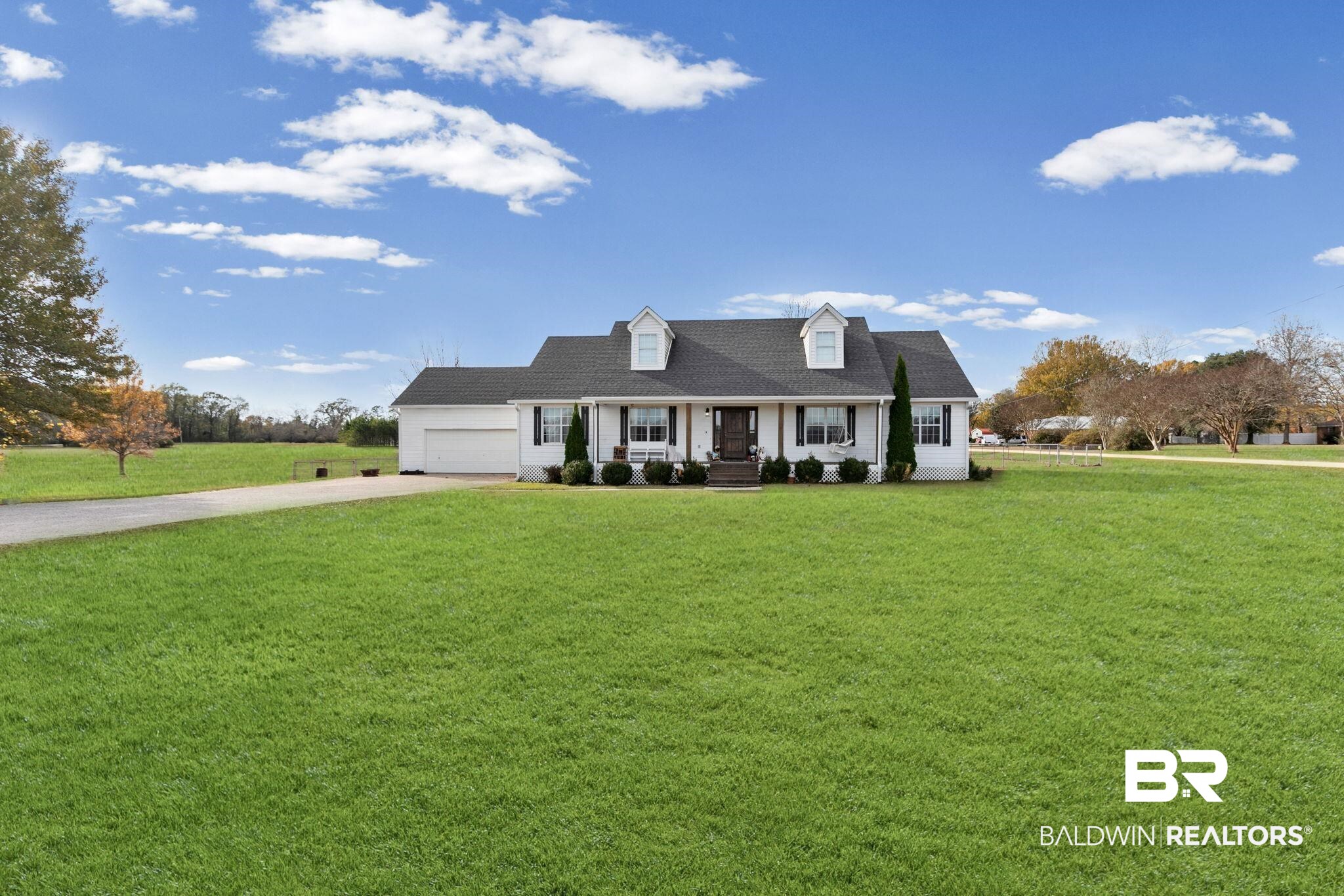 3842 Experiment Farm Road Monroeville, AL 36460 - Photo 2 of 59 Cape cod home featuring driveway, a front lawn, and covered porch