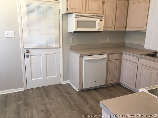 434 Saddle Ridge Road Fayetteville, NC 28311 - Photo 8 of 16 a kitchen with white cabinets and white appliances