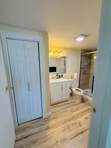 a bathroom with a sink a mirror and a shower