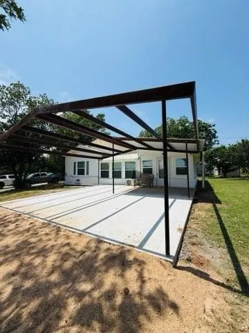 a view of a swimming pool with a porch