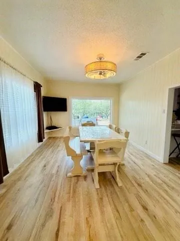 a dining room with a table and chairs in it