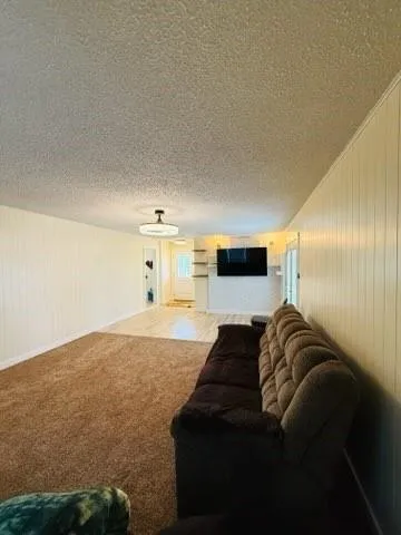 a bedroom with a bed and mirror