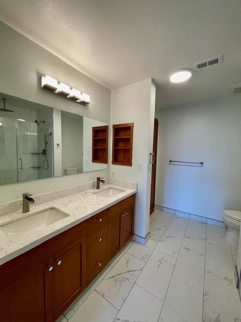 30 East Julian Street, Unit 201 San Jose, CA 95112 - Photo 11 of 25 a spacious bathroom with a double vanity sink toilet and a mirror