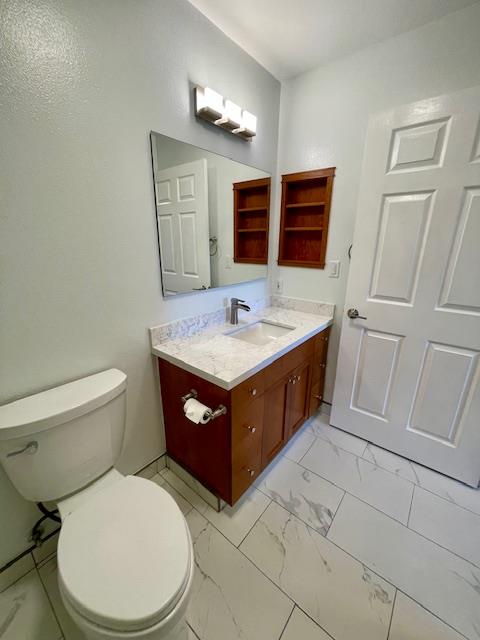 30 East Julian Street, Unit 201 San Jose, CA 95112 - Photo 19 of 25 a bathroom with a sink a toilet and mirror