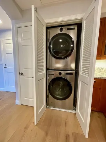 a view of a hallway with washer and dryer