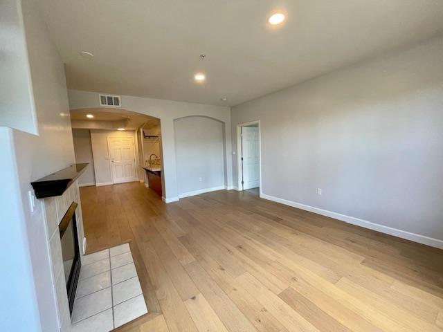 30 East Julian Street, Unit 201 San Jose, CA 95112 - Photo 8 of 25 wooden floor in an empty room with a window
