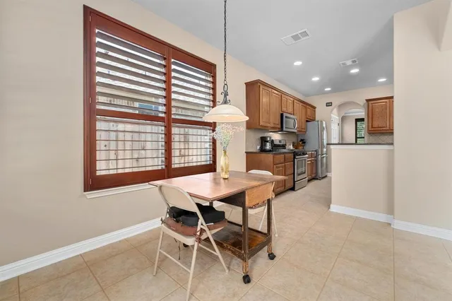 a bedroom with a large bed and a large window