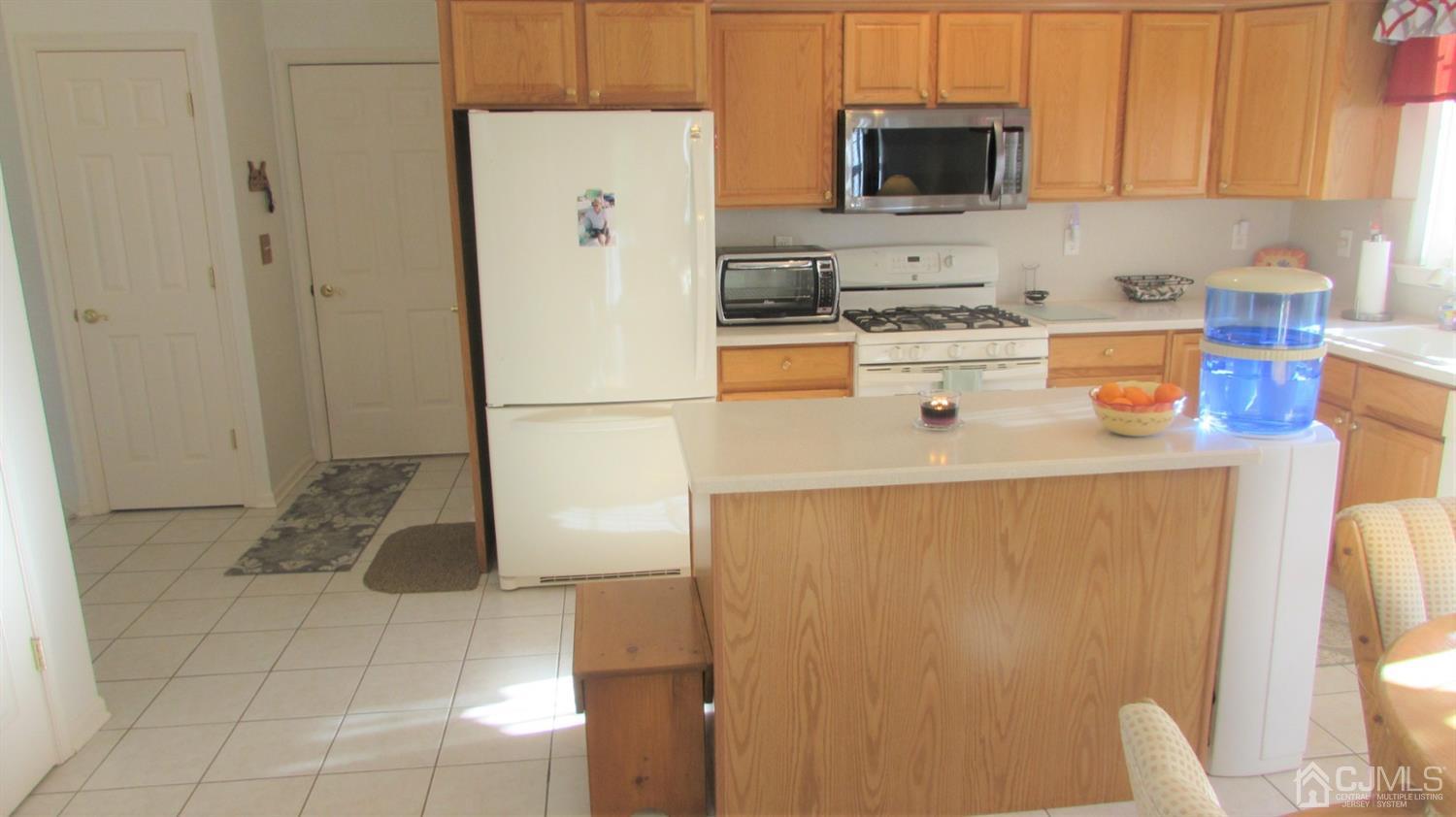 91 Wordsworth Road Brick, NJ 08724 - Photo 18 of 41 a white refrigerator freezer sitting inside of a kitchen