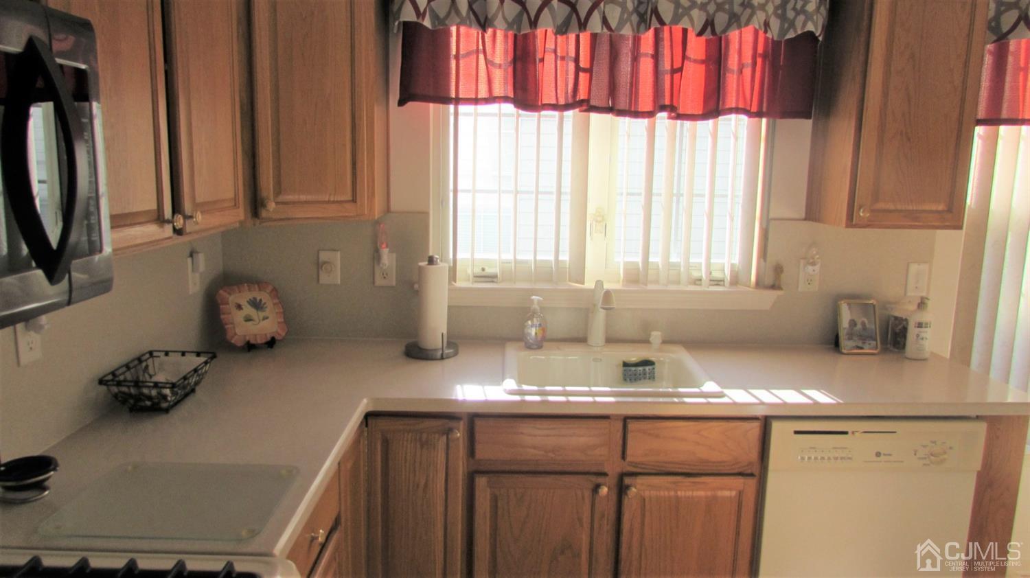 91 Wordsworth Road Brick, NJ 08724 - Photo 20 of 41 a kitchen with a sink a window and cabinets