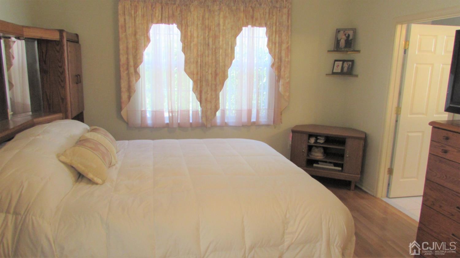 91 Wordsworth Road Brick, NJ 08724 - Photo 29 of 41 a bedroom with a bed and a tv