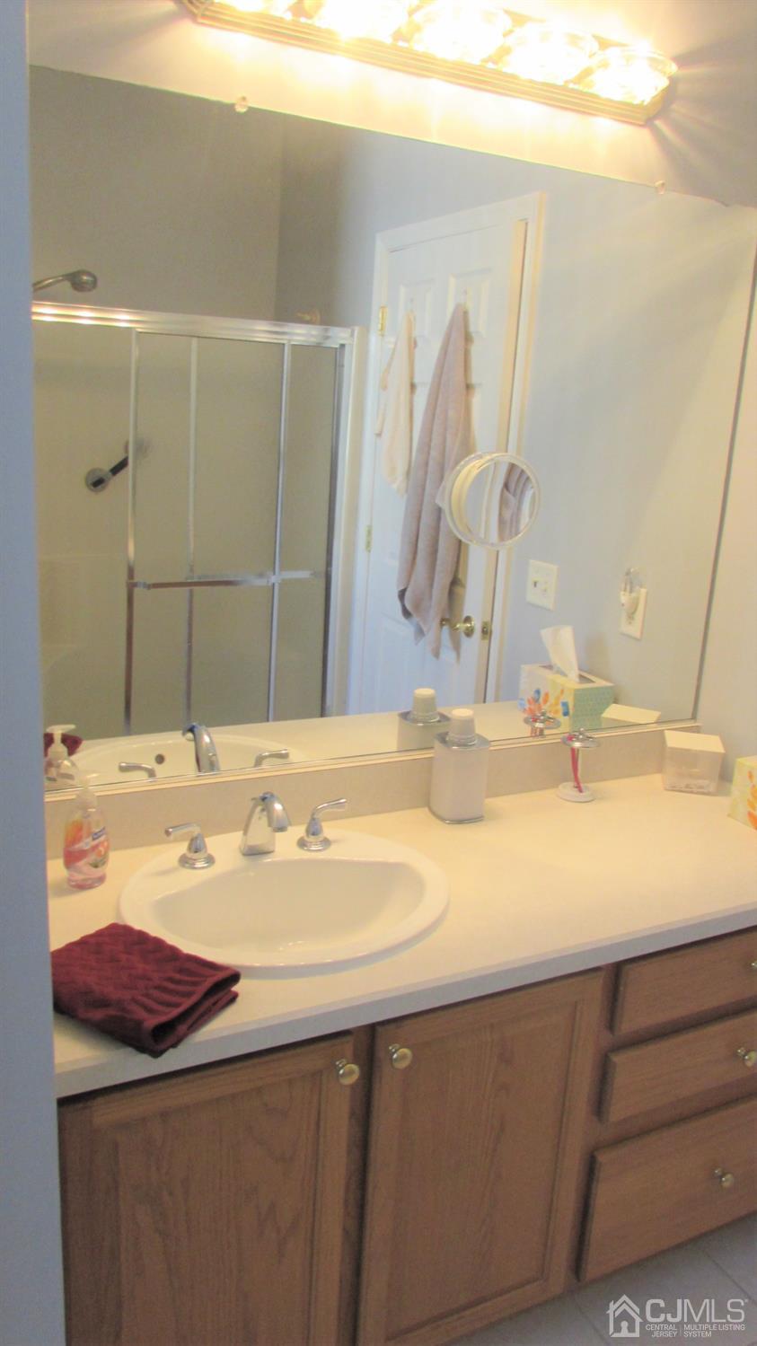 91 Wordsworth Road Brick, NJ 08724 - Photo 33 of 41 a bathroom with a sink and a mirror