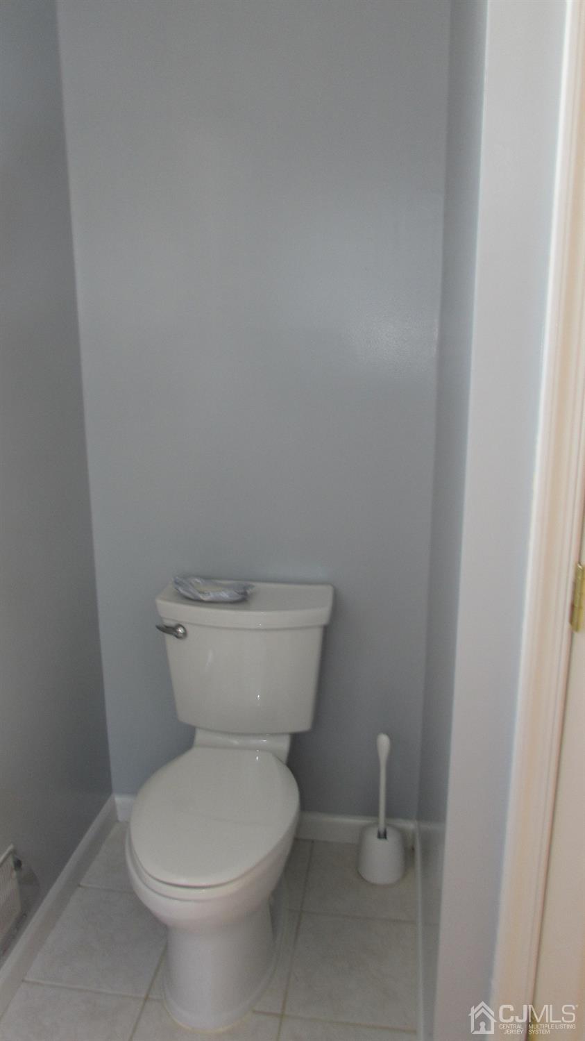91 Wordsworth Road Brick, NJ 08724 - Photo 35 of 41 a white toilet sitting next to a white sink